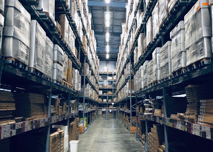 Warehouse shelves with stacked cartons ready for dispatch