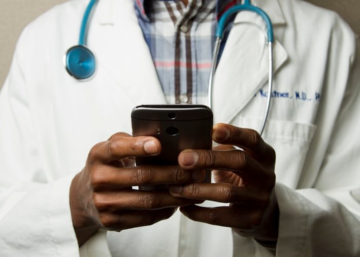 Healthcare professional using a computer at a clinic desk
