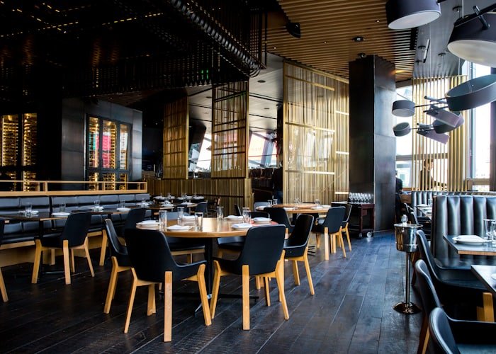 Restaurant interior with tables prepared for service